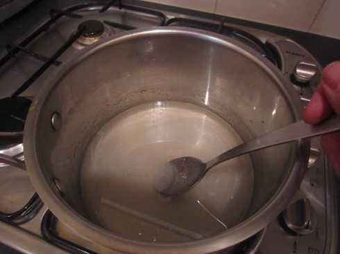 Sugar and water in saucepan
